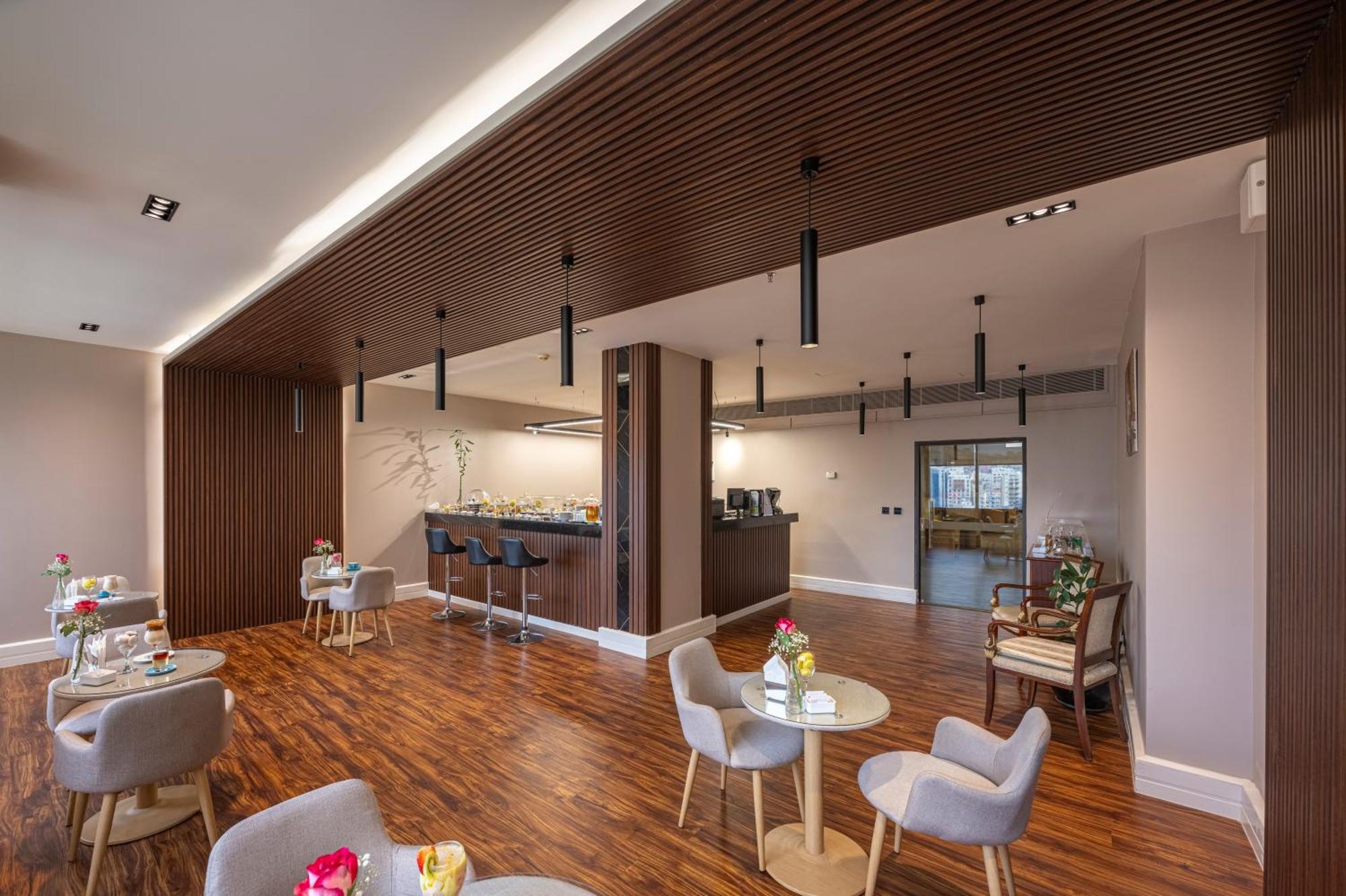 Al Shohada By Palm Rich Makkah Hotel Мека Екстериор снимка The dining room at the new St. Mary's Hospice